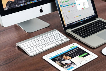 a desktop, laptop and tablet